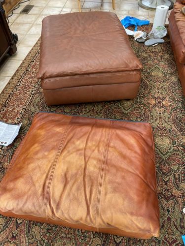 Click to view full screen Photo contrasting discolored leather cushion and ottoman after Rust Rub n Restore